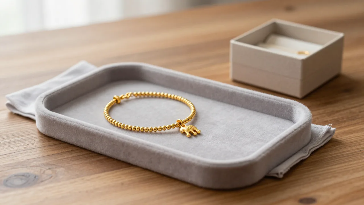 Chinese zodiac charm bracelet on a tray for separating symbol and material checks